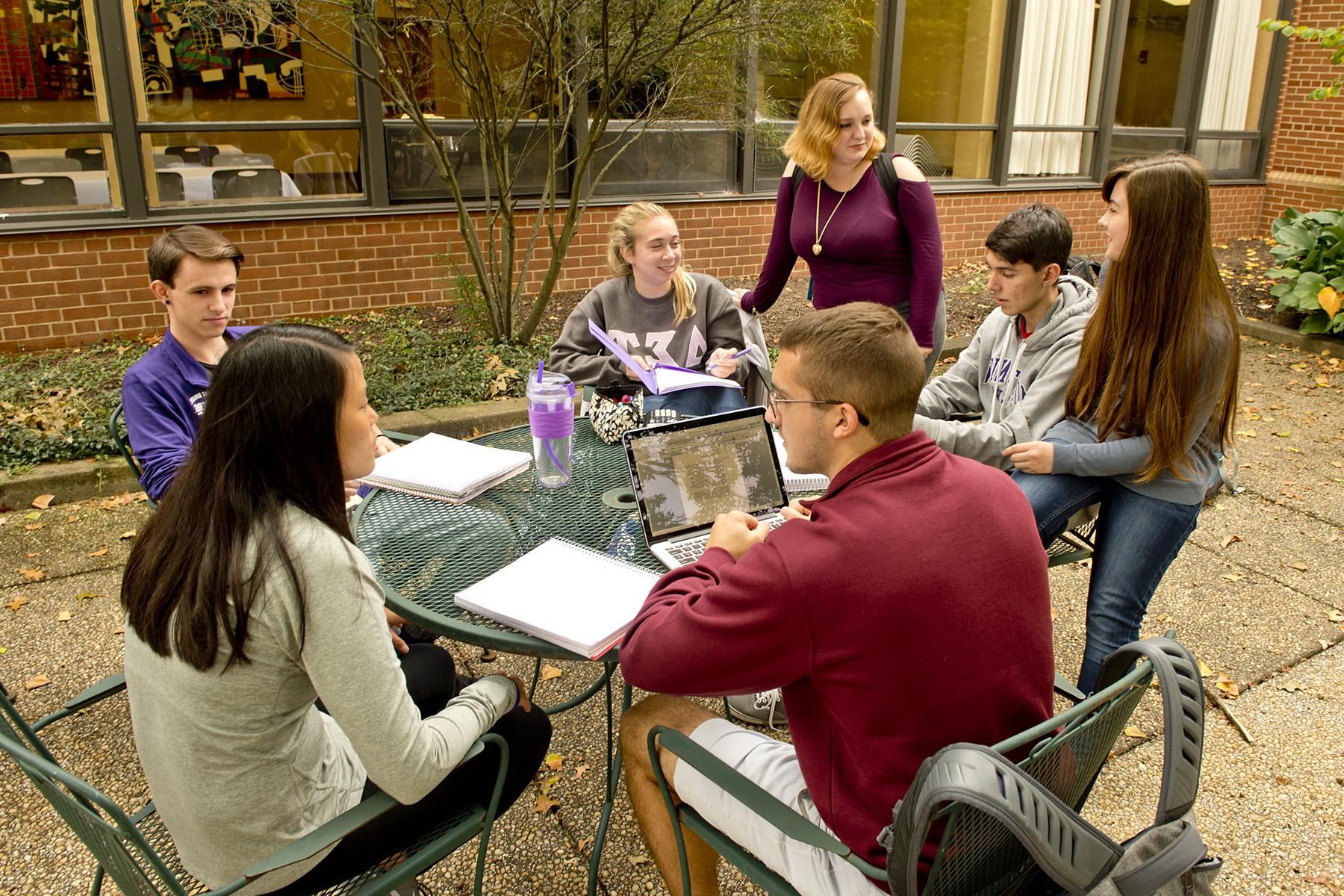 Students gathered in courtyard talking